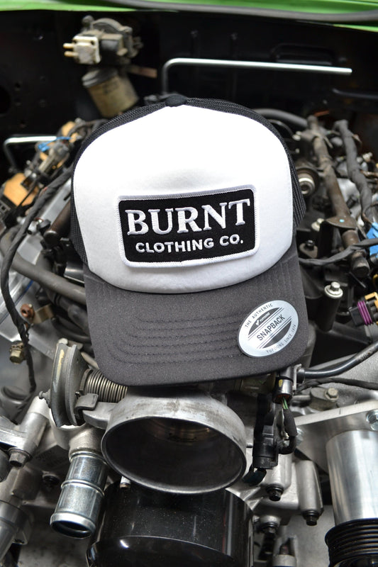 Engine with a 'Burnt Clothing Co.' cover and visible branding.