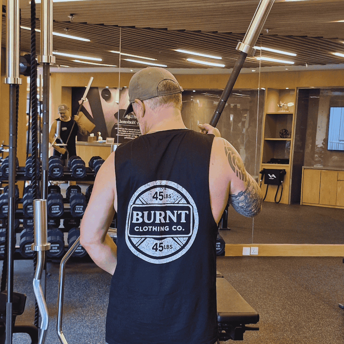 Model wearing black 45 Plate tank top by Burnt Clothing Co.