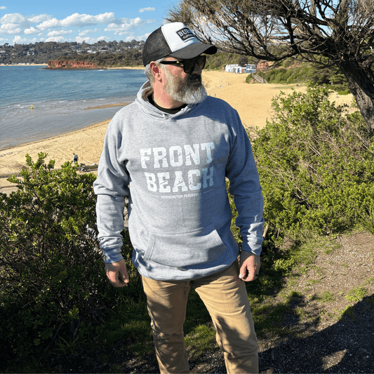 Man wearing the Front Beach grey marle hoodie at a Mornington Peninsula coastal lookout