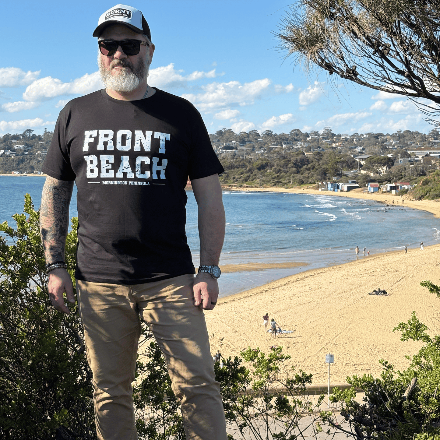 Full-length view of the Front Beach black tee overlooking the Mornington Peninsula coastline
