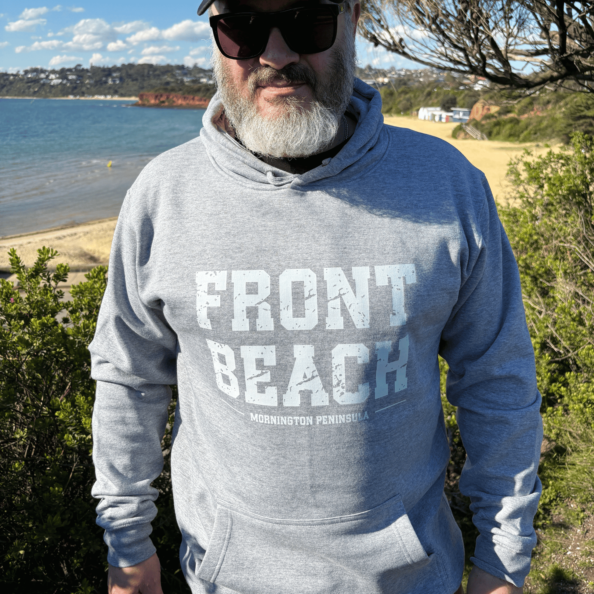 Close-up of the distressed white Front Beach print on the grey marle hoodie