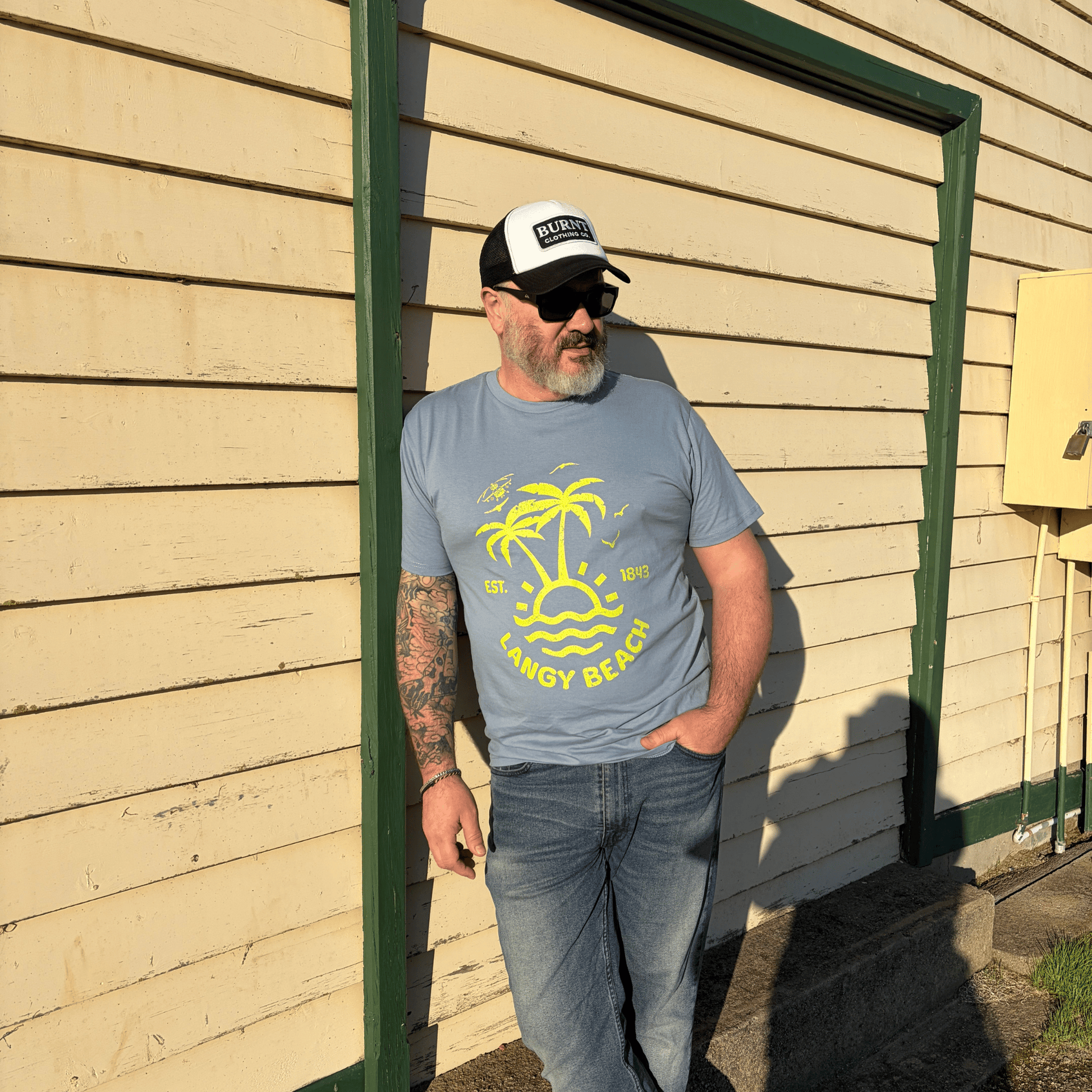 Model wearing Langy Beach graphic tee by Burnt Clothing Co