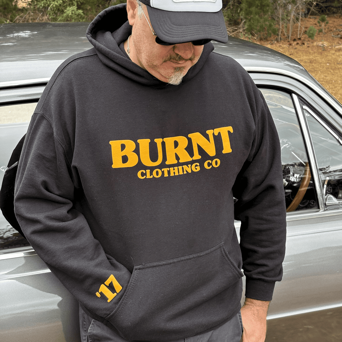 Lucky #17 black hoodie with raised orange puff print.