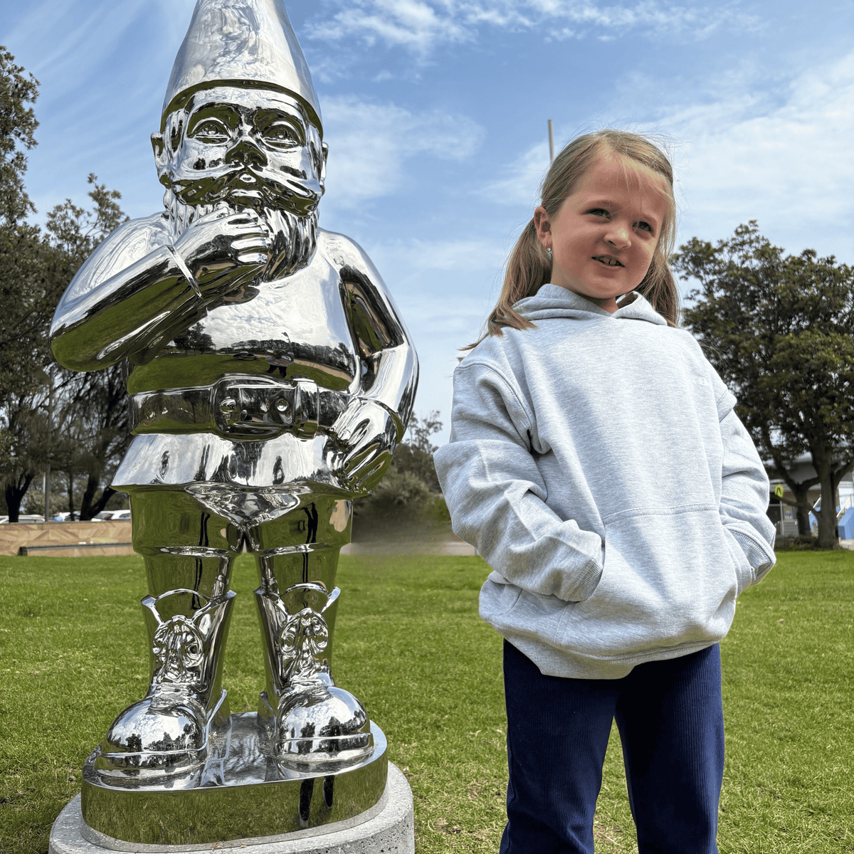 Child wearing grey kids pullover hoodie, front view