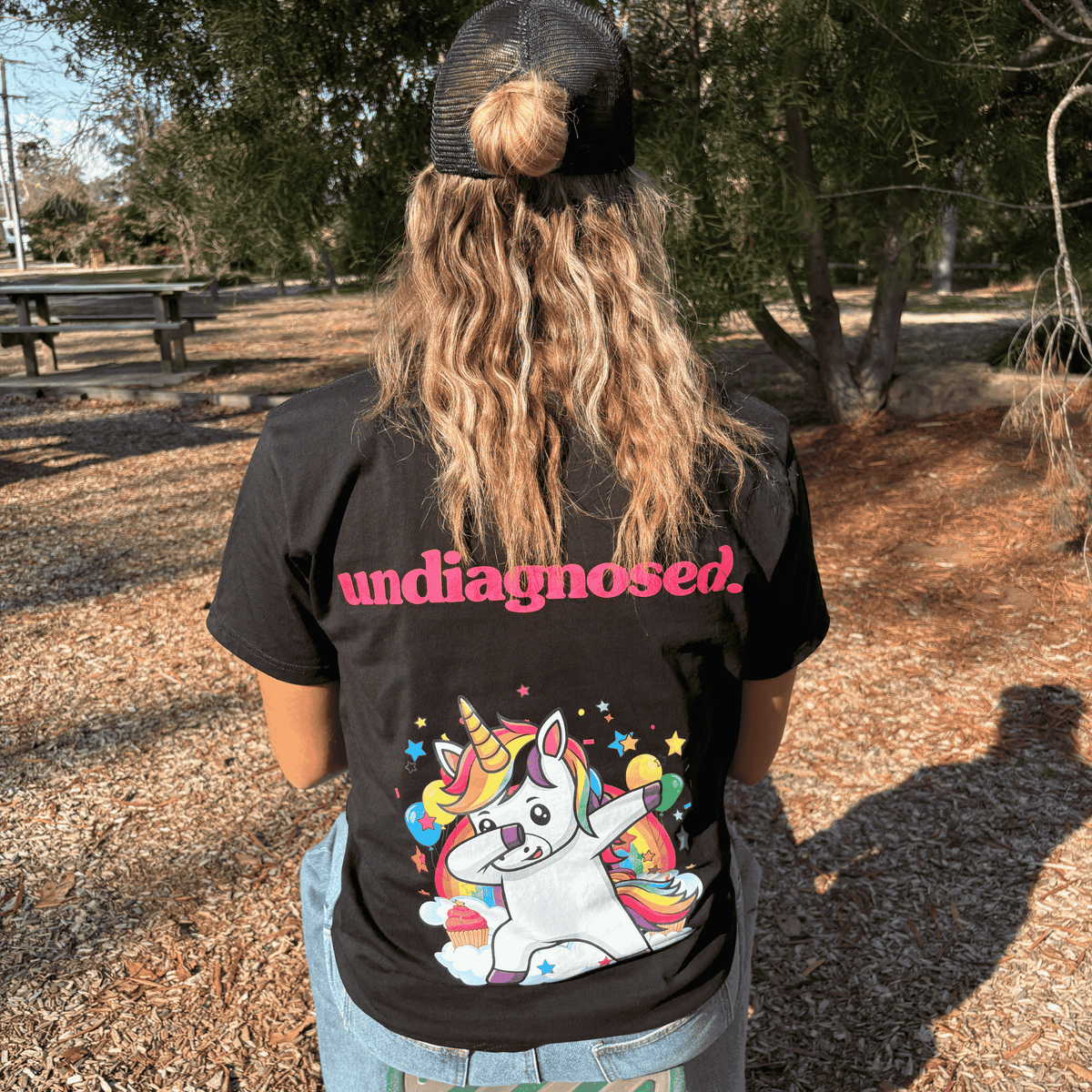 Black undiagnosed. Unicorn t-shirt with pink back print and full-colour graphic.
