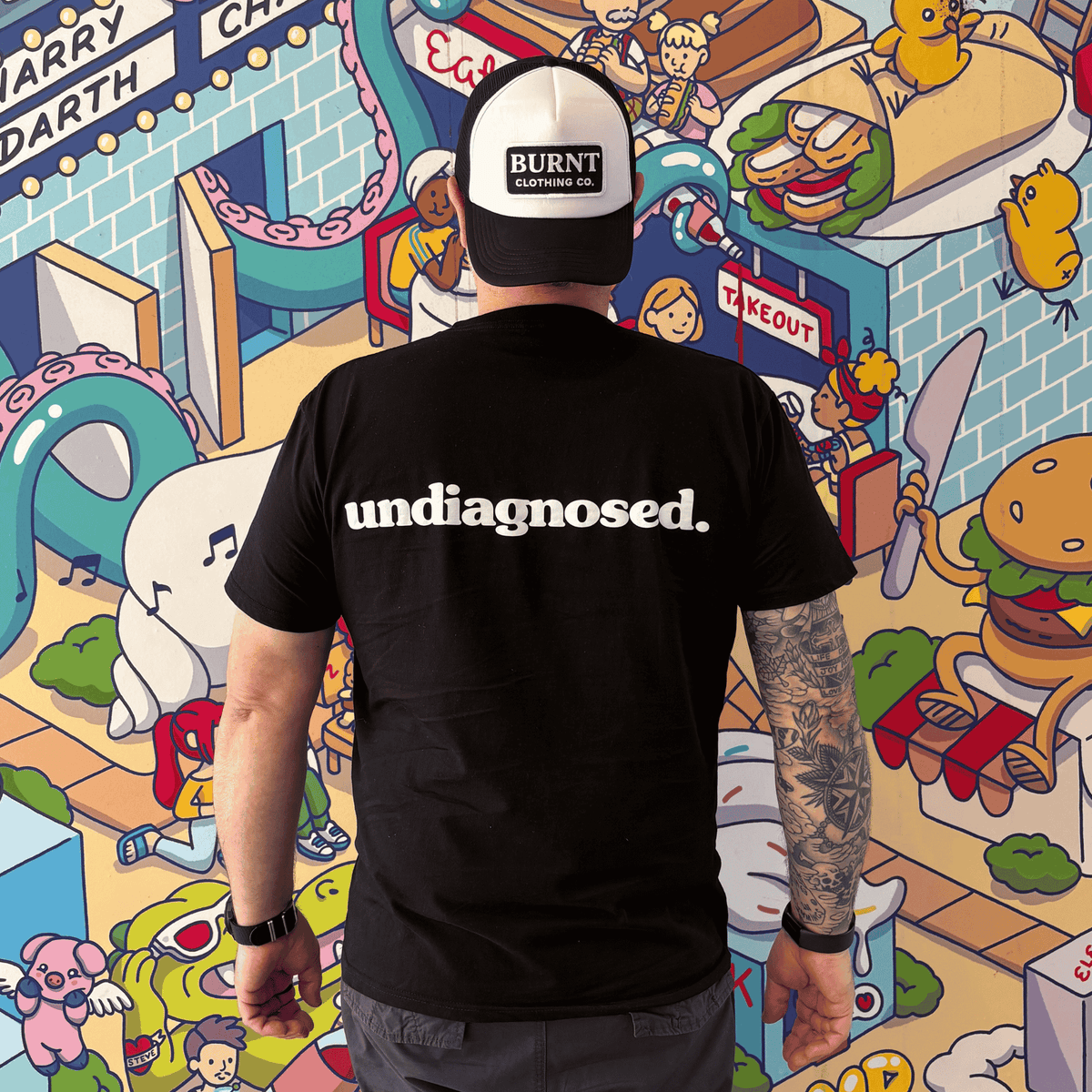 Black undiagnosed. t-shirt with white statement print by Burnt Clothing Co.