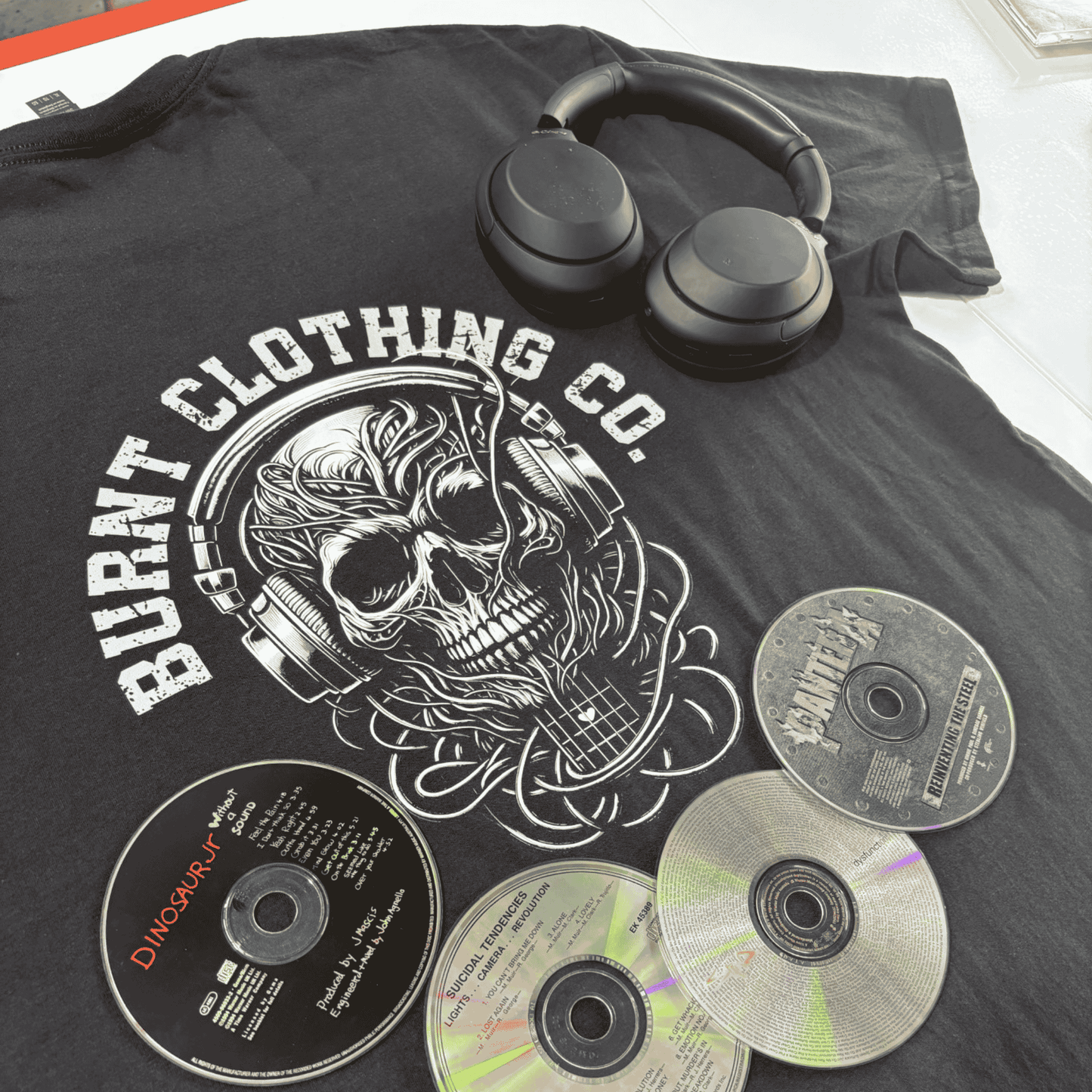 Burnt Clothing Co skull headphones graphic on black t-shirt