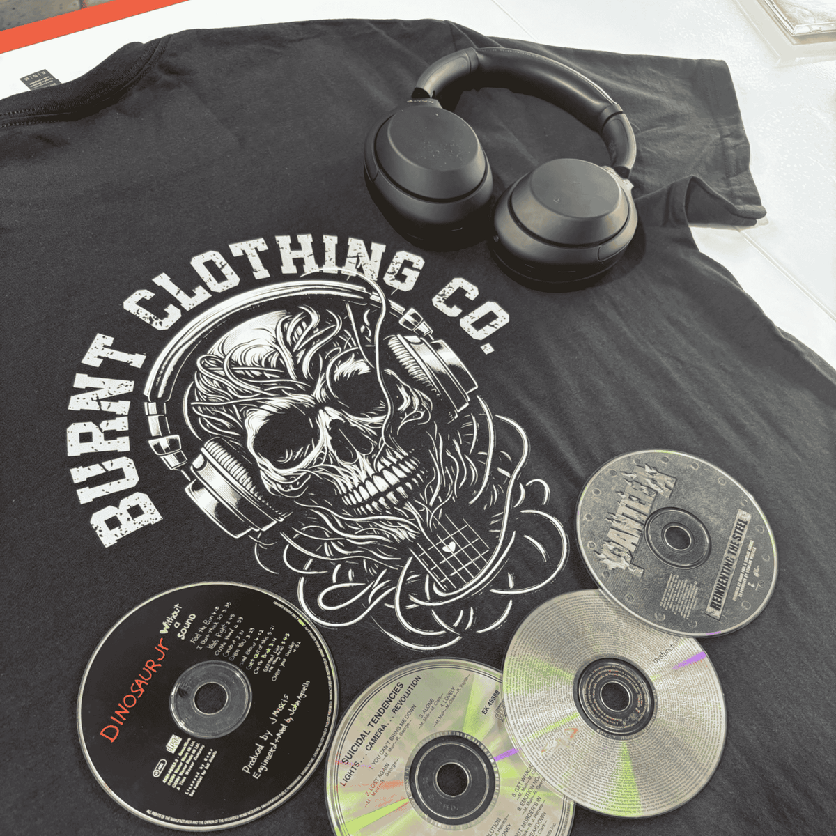 Burnt Clothing Co skull headphones graphic on black t-shirt