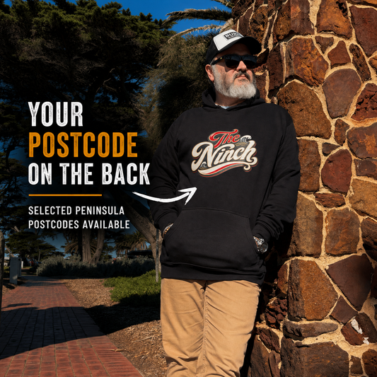 The Ninch black postcode hoodie front view with text explaining selected Mornington Peninsula postcodes are available