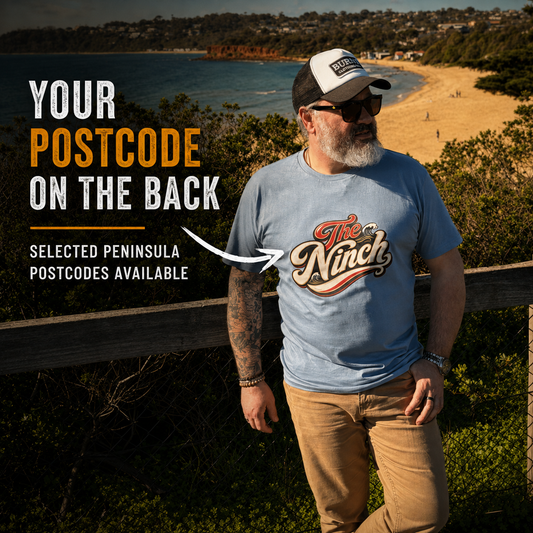 The Ninch dusty blue postcode tee front view with selected Mornington Peninsula postcodes available
