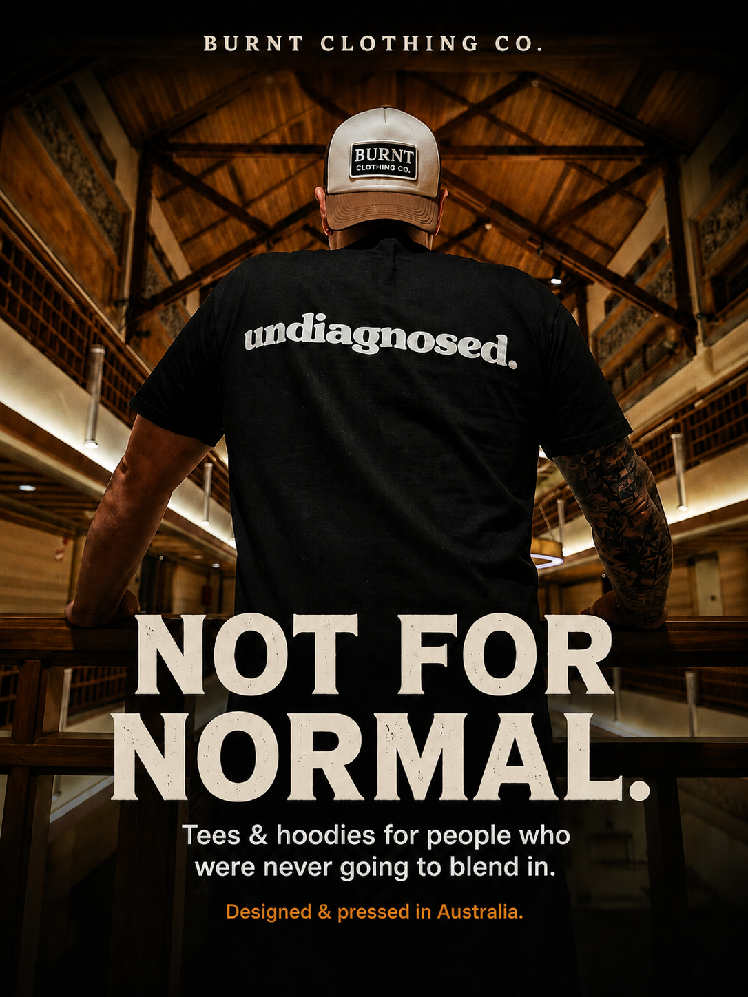 Man wearing a black Burnt Clothing Co. undiagnosed. T-shirt and cap, featured in the Not for Normal homepage banner.