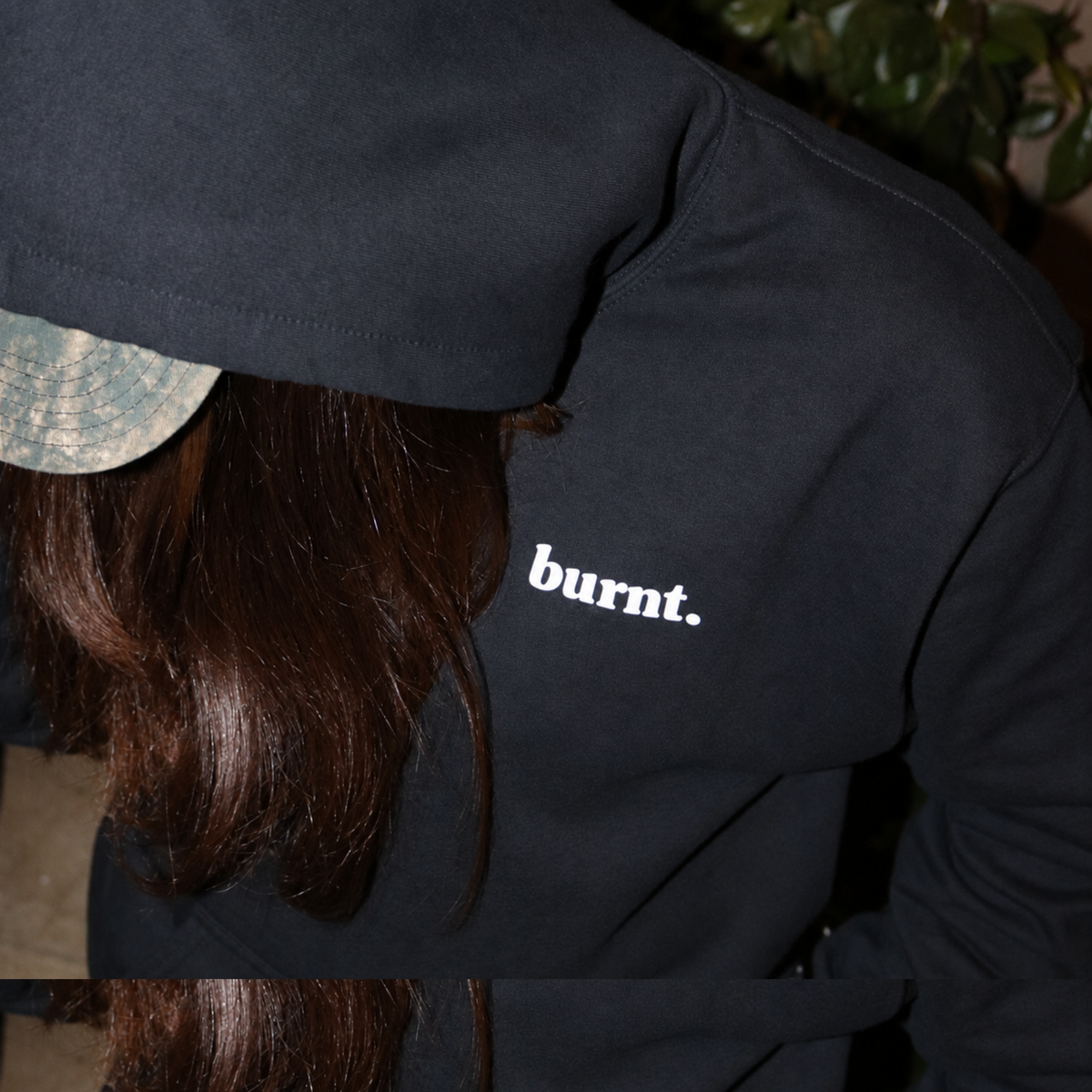 Front view of black undiagnosed. hoodie by Burnt Clothing Co., retouched product photo.
