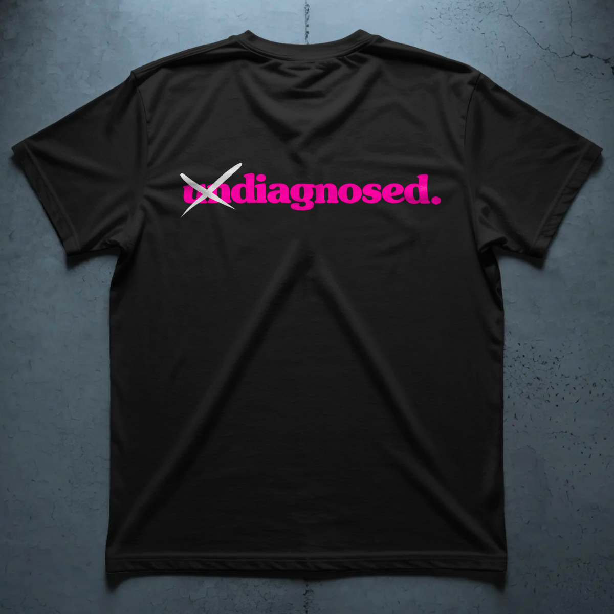 Black diagnosed. limited edition tee with pink front print and crossed-out white un detail by Burnt Clothing Co.