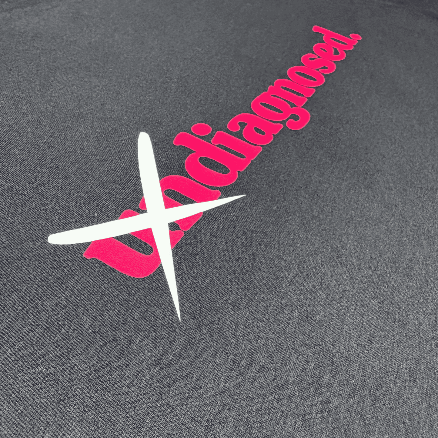 Black diagnosed. limited edition tee with pink front print and crossed-out white un detail by Burnt Clothing Co.