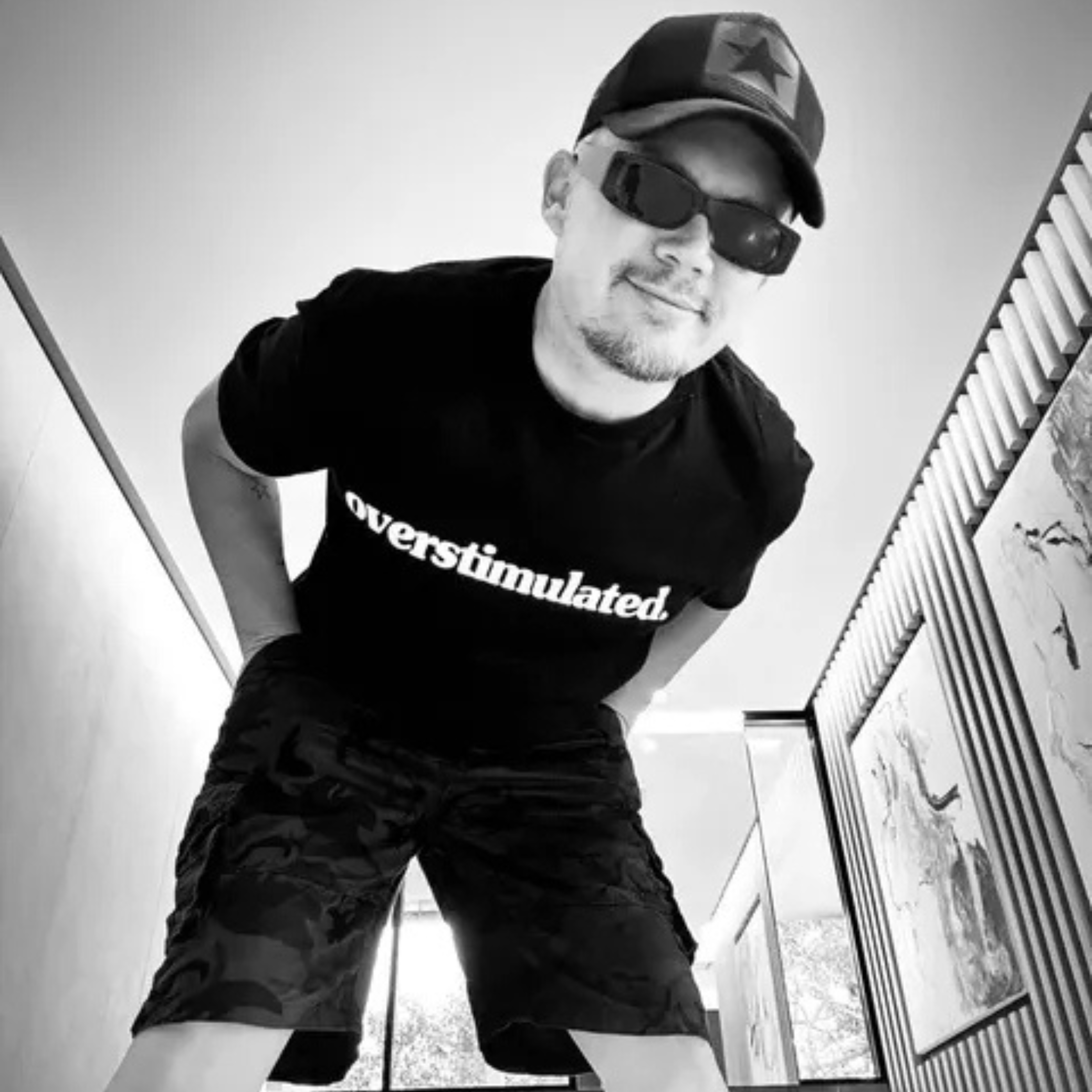 Black-and-white lifestyle photo of the overstimulated. tee