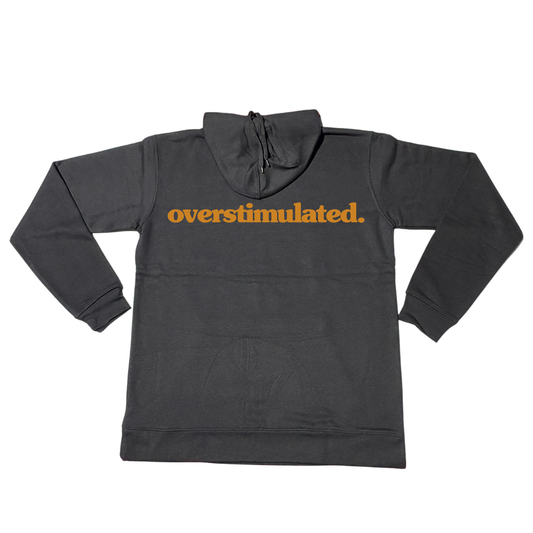Black overstimulated. hoodie with burnt orange front print, shown flat.