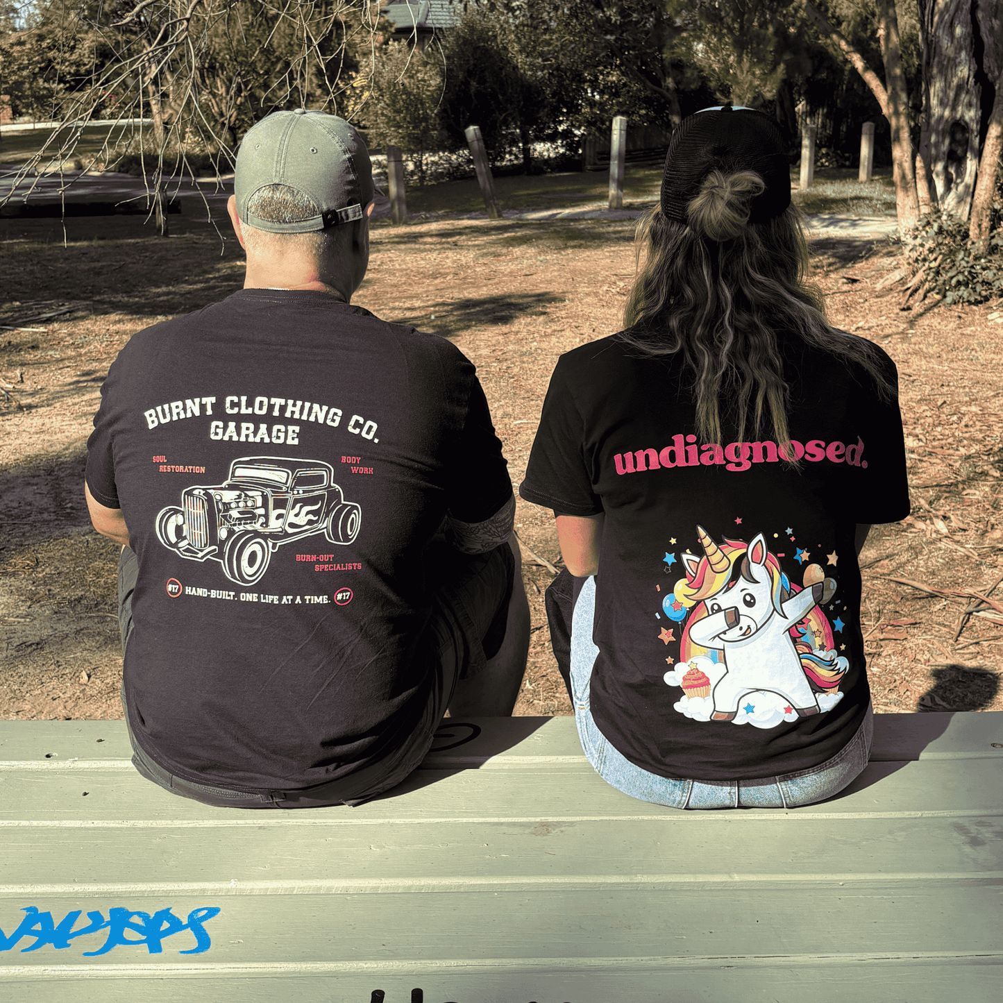 Two people wearing Burnt graphic t-shirts featuring Soul Restoration Garage and undiagnosed. back prints