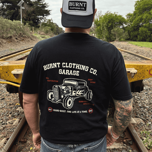 Rear view of Burnt Soul Restoration Garage black tee featuring vintage hot rod back print