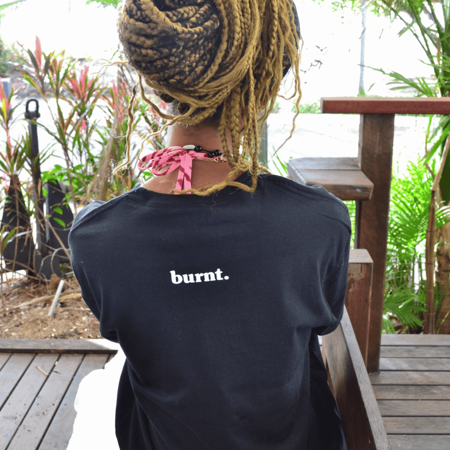 Back detail of The Quiet War black graphic tee by Burnt Clothing Co