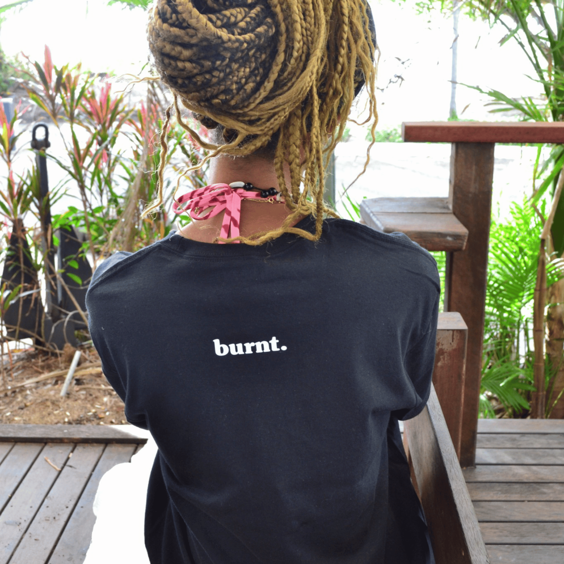 Back detail of The Quiet War black graphic tee by Burnt Clothing Co