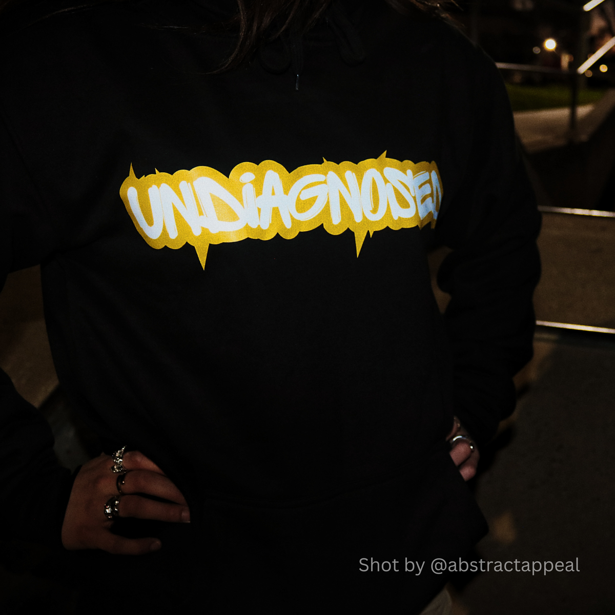 Model wearing the undiagnosed. limited edition black hoodie