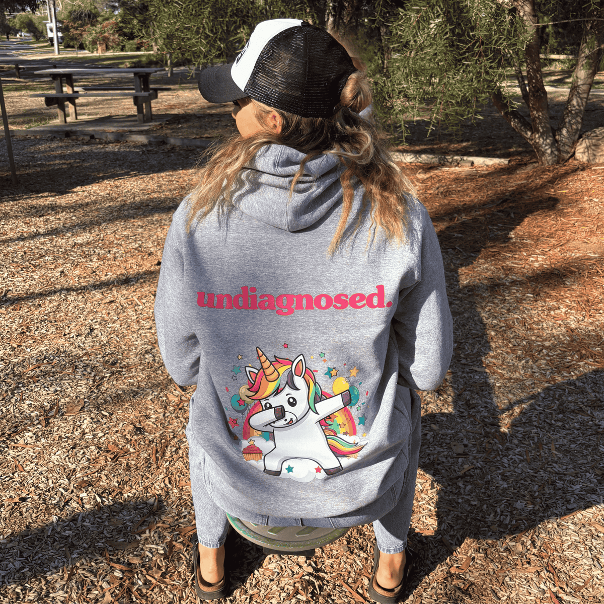 Grey marle undiagnosed. Unicorn hoodie with full-colour back graphic and pink print.